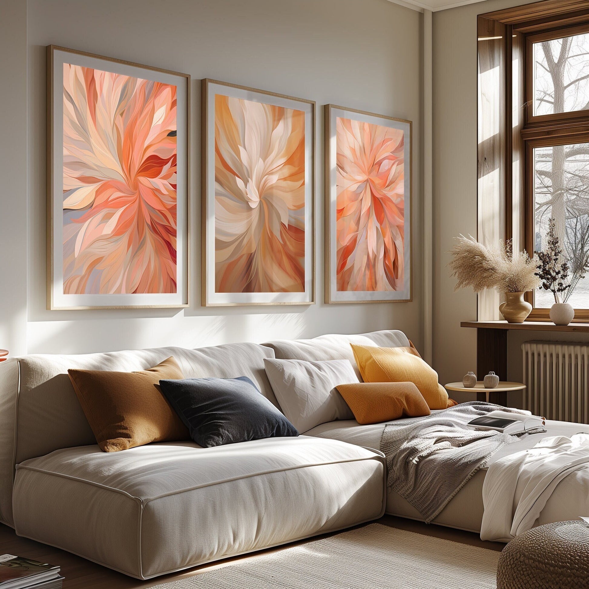 Three abstract art prints with fiery floral designs in rich autumn shades, enhancing a cozy living room with an elegant, seasonal touch.