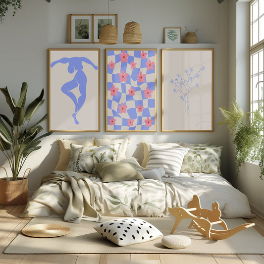 A striking collection of prints, featuring a dynamic blue silhouette and floral patterns, adding elegance to a contemporary living room.