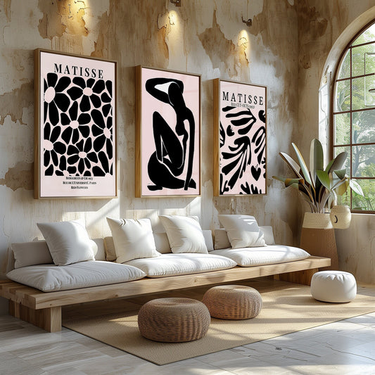 An elegant trio of Matisse-inspired prints in black and pink, each offering a unique take on form and silhouette, against a rustic wall.