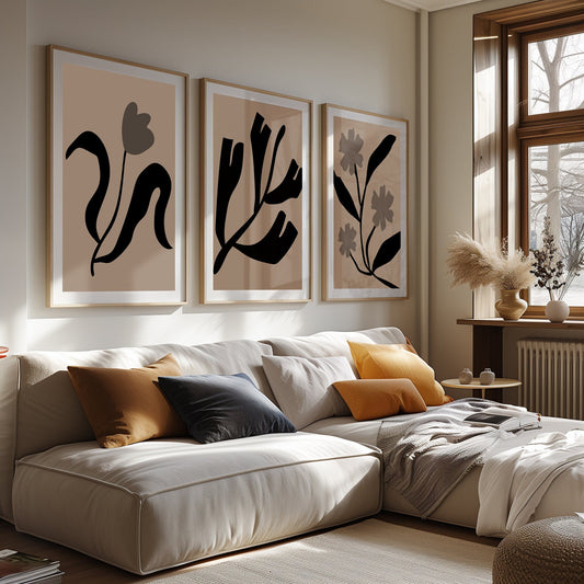 Set of three serene botanical art prints with fluid abstract forms, blending harmoniously with the calm and cozy decor of a modern living space.