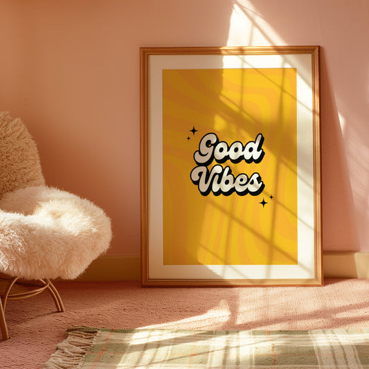 A retro-style poster with the text &quot;Good Vibes&quot; in bold, bubbly letters on a bright yellow background with a wavy pattern.