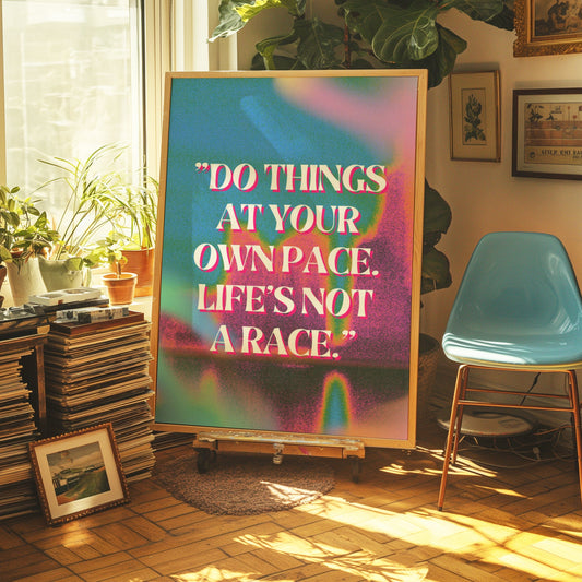 A vibrant motivational poster with the text &quot;Do things at your own pace. Life&#39;s not a race.&quot; displayed on a colorful abstract background.