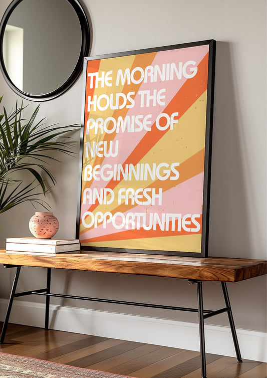 A motivational art print with the text &quot;The morning holds the promise of new beginnings and fresh opportunities&quot; on a warm, sunrise-themed background.