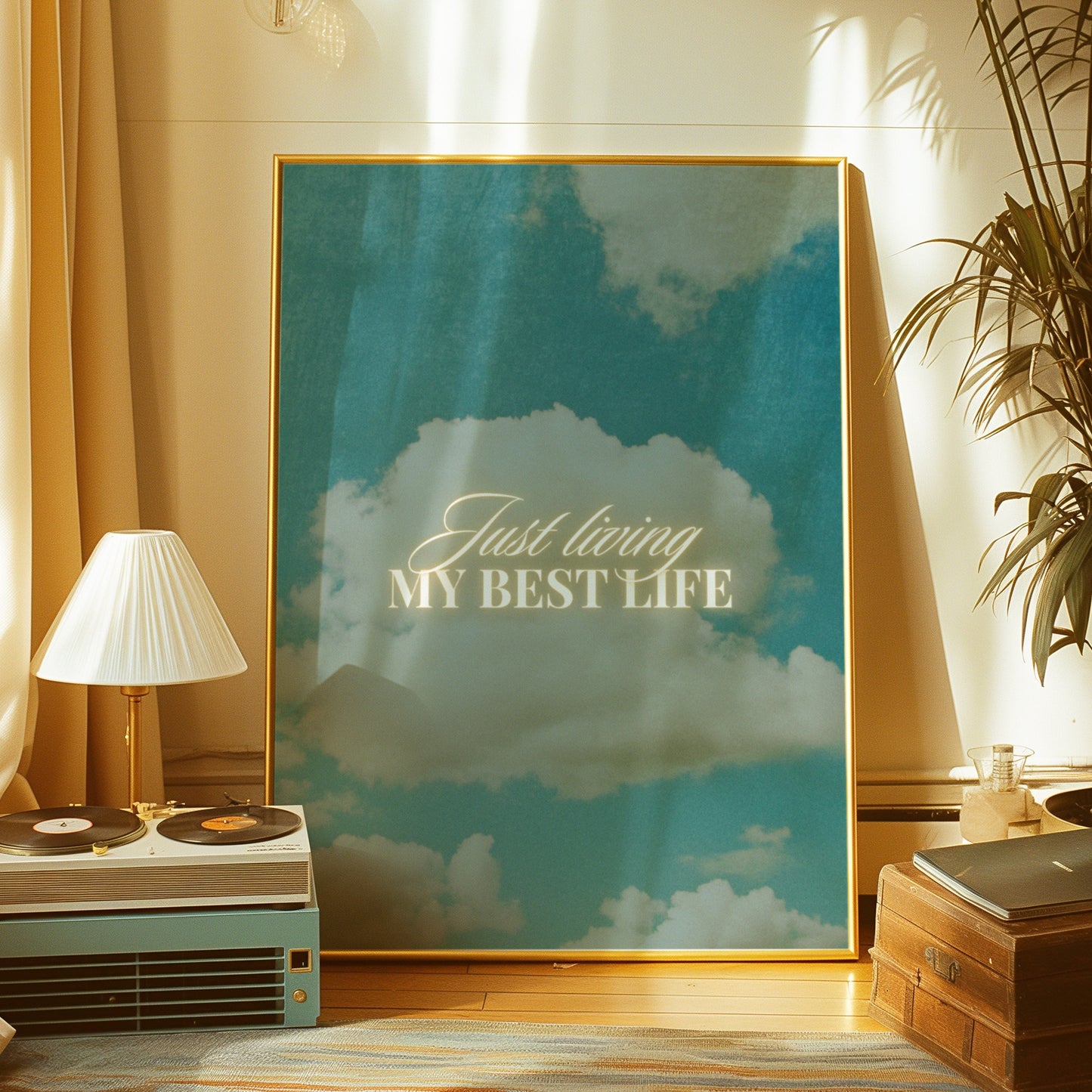 An inspirational art print with the phrase "Just living my best life" over a serene sky and clouds background.