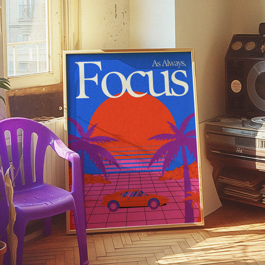 A motivational poster with the word &quot;Focus,&quot; featuring a retro design with a large red sun, a car, and palm trees against a vibrant blue and orange background.