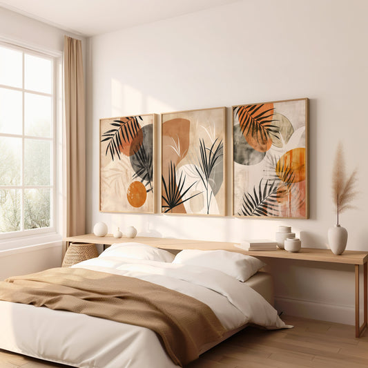 A set of three modern abstract botanical wall art prints featuring earthy-toned palm leaves, perfect for boho or minimalist decor in a living room or bedroom.