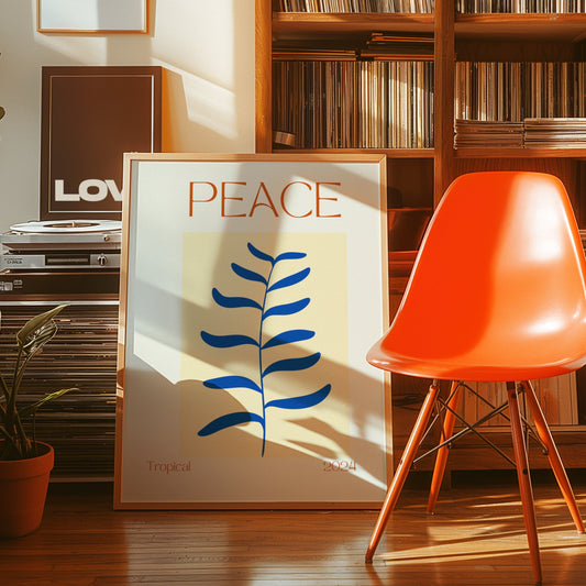 A retro-style &quot;Peace Tropical 2024&quot; poster featuring a minimalist blue leaf illustration on a soft yellow background, displayed near a record player and surrounded by warm, cozy decor.