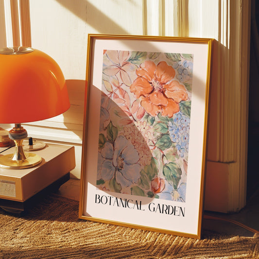 A framed Botanical Garden poster featuring a colorful watercolor floral design, placed on a windowsill with a cityscape view in the background, adding a touch of nature and color to the room.