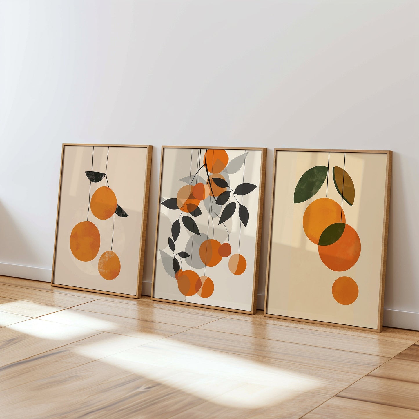 A three-piece poster set featuring abstract orange fruit designs in minimalist style, perfect for modern and bohemian home decor, especially in kitchens or dining areas.