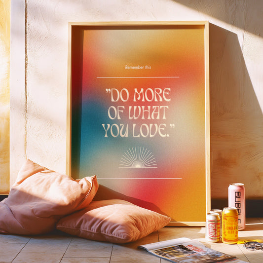 A motivational poster with the text &quot;Do More of What You Love&quot; set against a vibrant, multi-colored background with a minimalist design.