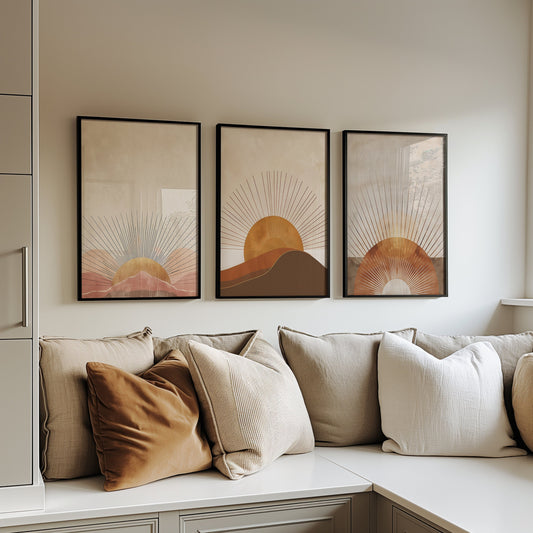 A set of three minimalist sunburst posters featuring abstract sun and mountain designs in warm earth tones, perfect for adding a modern and calming touch to any room.