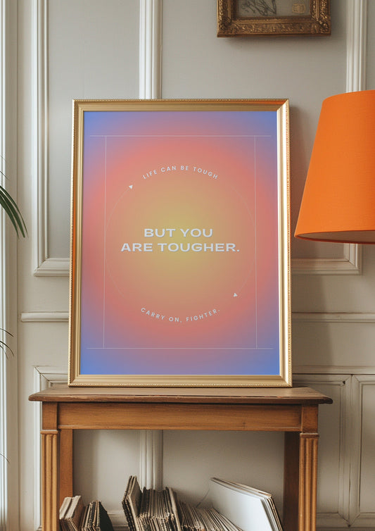 A motivational poster with the text &quot;Life Can Be Tough But You Are Tougher&quot; set against a vibrant, gradient background with a minimalist design.