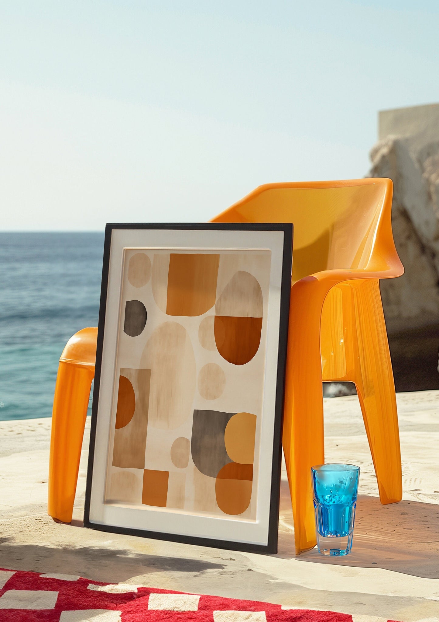 A vibrant mid-century modern art print featuring abstract geometric shapes in warm earth tones, elegantly framed in a gold-colored frame, perfect for adding a retro touch to any room.