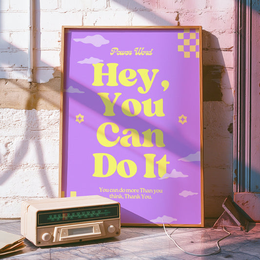 A motivational poster with the words &quot;Hey, You Can Do It&quot; in bold yellow text on a purple background, featuring playful clouds and checkered patterns.