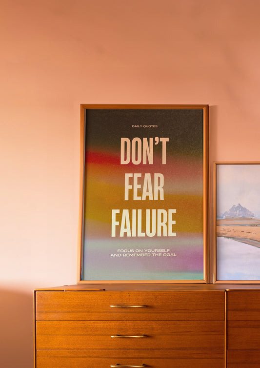 A motivational poster with the words &quot;Don&#39;t Fear Failure&quot; in bold white text on a colorful gradient background, promoting focus and goal remembrance.