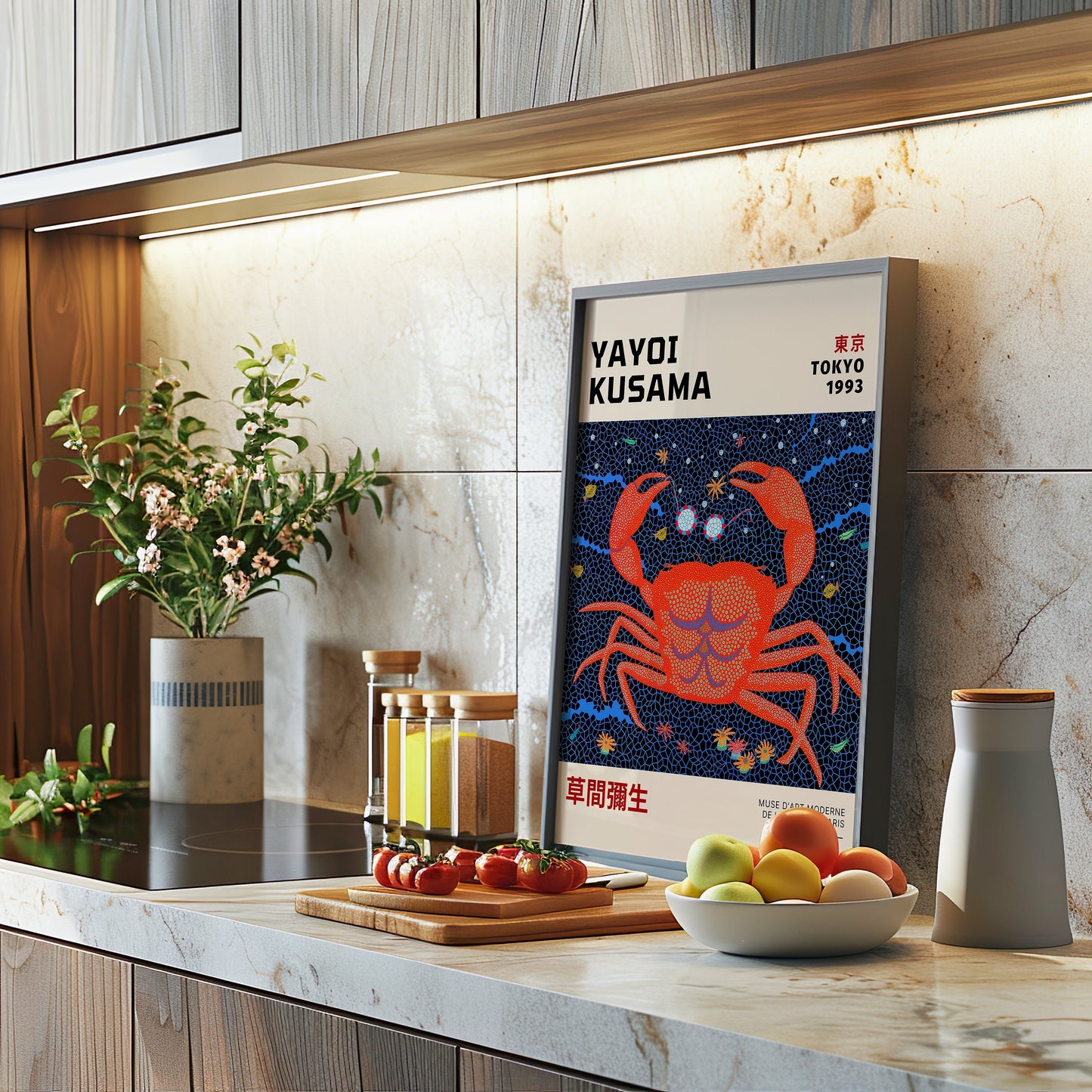 A vibrant Yayoi Kusama Tokyo 1993 crab art poster displayed in a sleek, modern kitchen. The orange polka dot crab stands out against a deep blue background, adding an artistic touch to the minimalist marble setting.