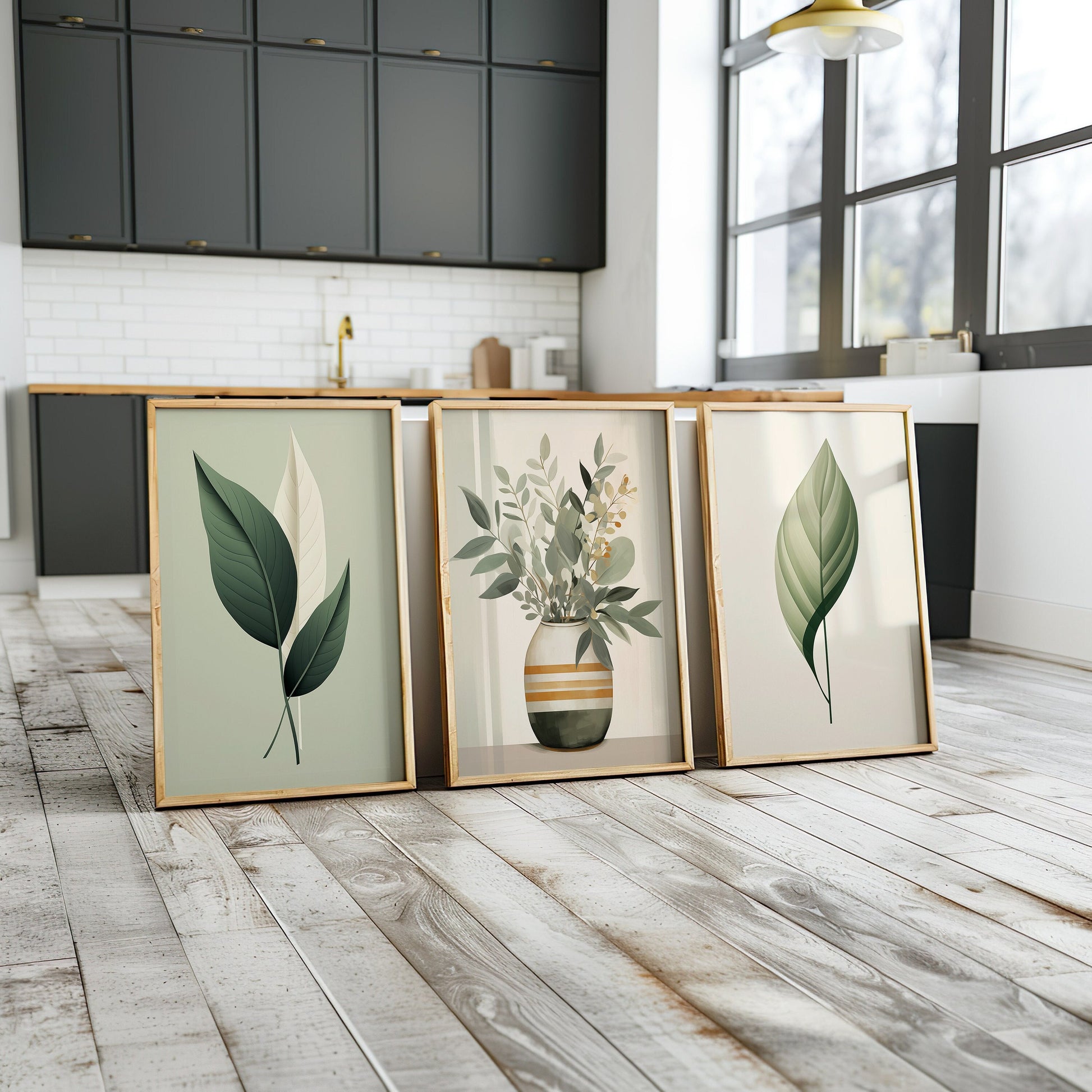 A set of three green leaf art prints featuring minimalist leaf designs and a botanical arrangement in a vase, perfect for enhancing living room decor with natural elements.