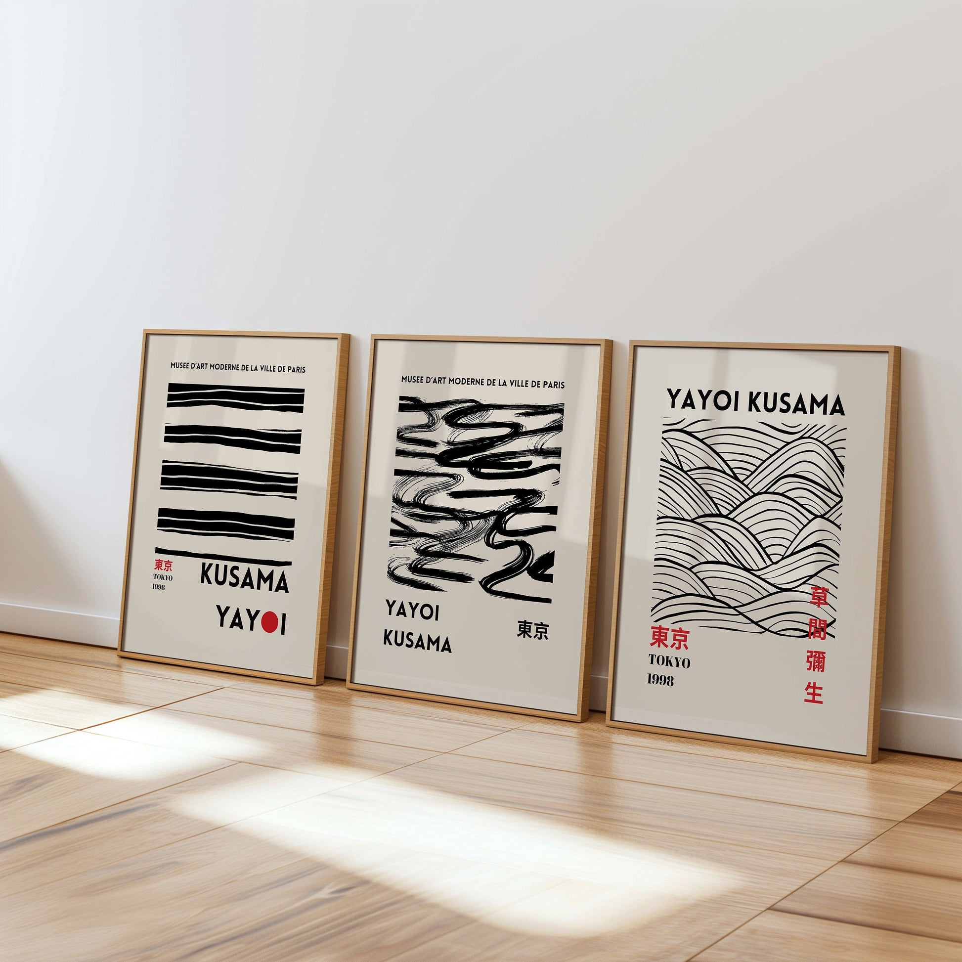 A set of three Yayoi Kusama minimalist black line posters featuring wave patterns and brushstrokes, perfect for contemporary wall decor.