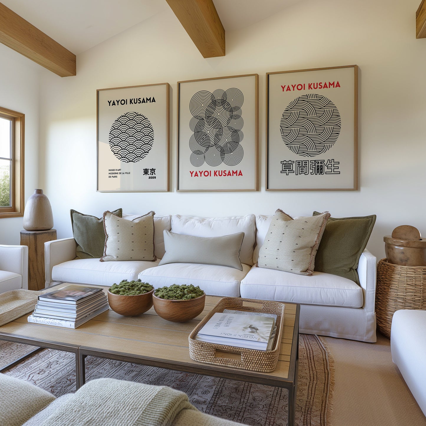 Three framed Yayoi Kusama posters showcasing minimalist Japanese circle patterns in black and white, arranged in a modern bohemian interior setting.