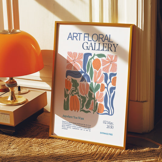 A retro-inspired poster for an art floral gallery, featuring vibrant botanical illustrations in blue, orange, and green, framed in a gold frame and displayed in an elegant room.