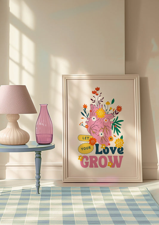 A vibrant &quot;Let Your Love Grow&quot; poster featuring a heart illustration surrounded by colorful flowers. The motivational message is designed in playful typography, adding a touch of positivity and boho charm to any space, perfect for inspiring growth