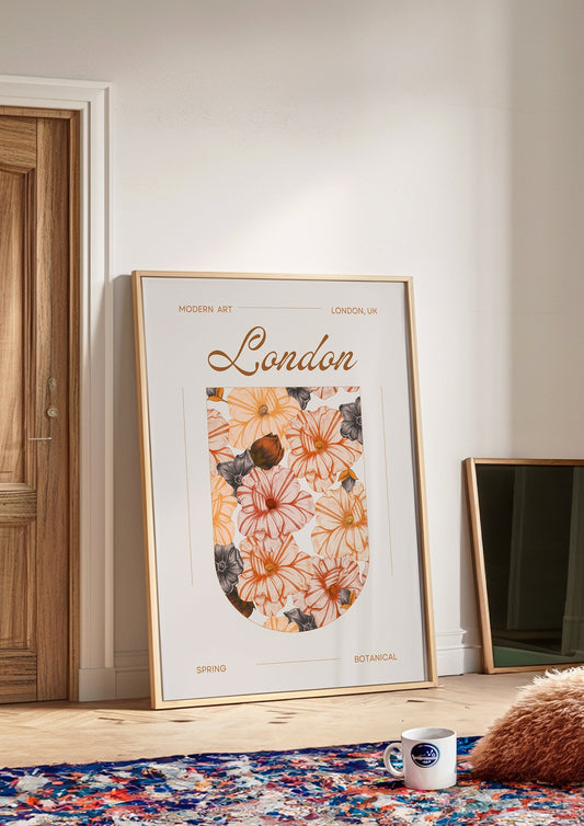 A framed botanical art print titled &quot;London&quot; featuring an elegant spring flower illustration in orange and beige tones, set within a stylish arch, perfect for modern and chic home decor.