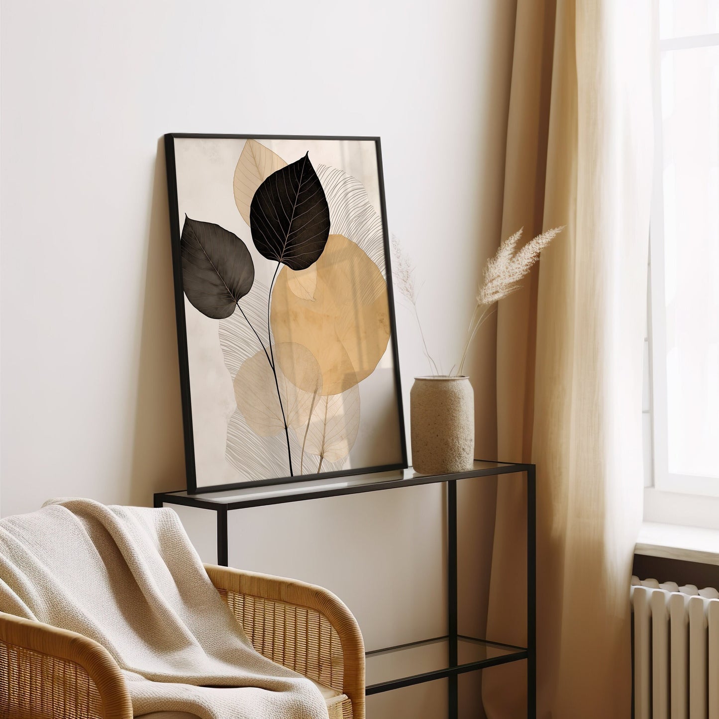 A modern art print featuring delicate black and gold leaves against a subtle background, creating a minimalist and contemporary botanical design ideal for chic home decor.