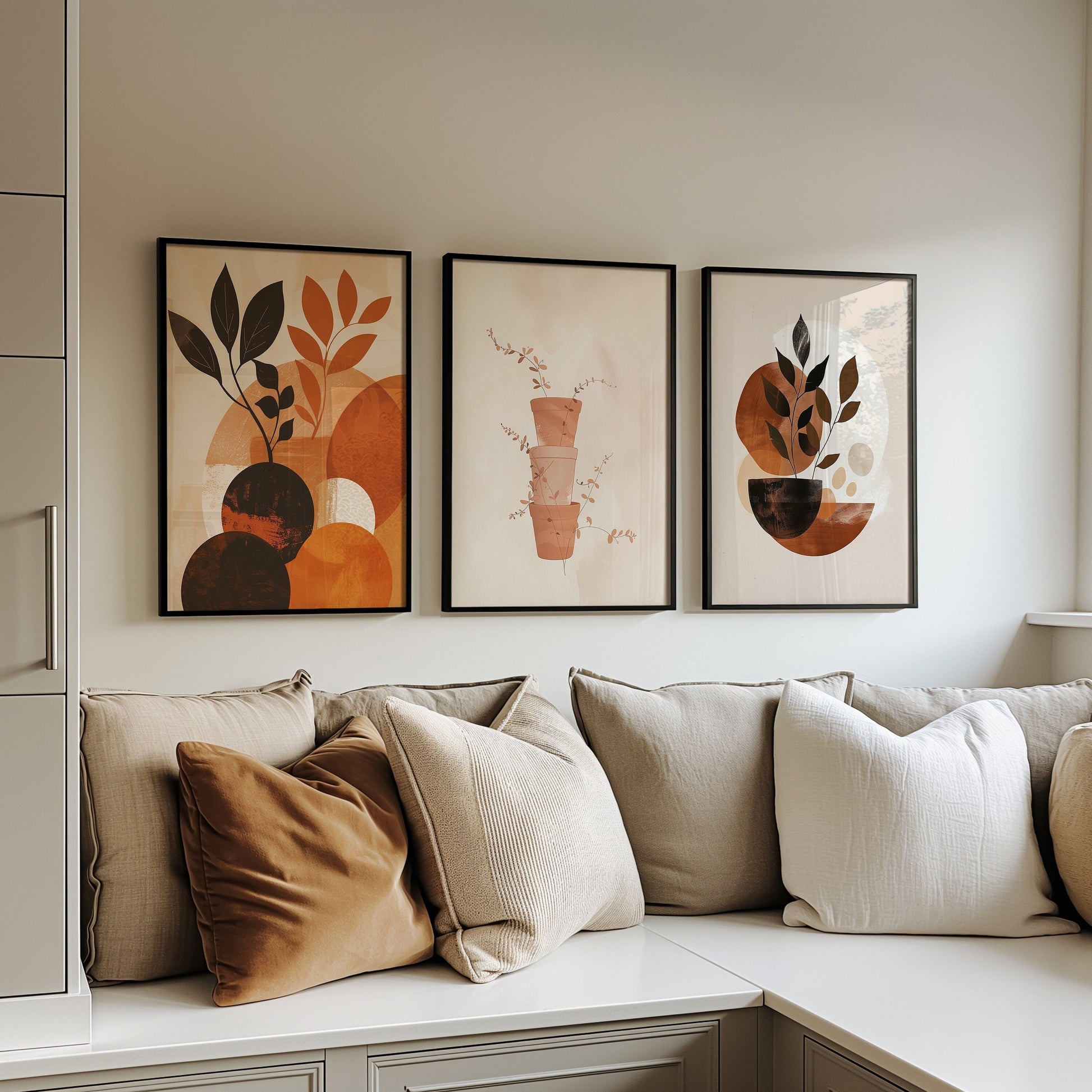 A set of three minimalist botanical art prints featuring neutral tones and abstract plant designs, perfect for modern and boho-inspired home decor.