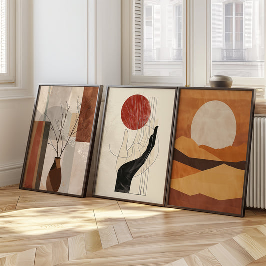 A set of three abstract art prints featuring a minimalist hand with a red sun, geometric shapes, and earthy tones, perfect for modern interior decor.