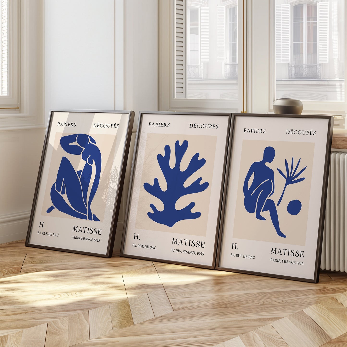 A trio of minimalist Henri Matisse posters featuring his famous blue cut-out designs, perfect for adding a modern and artistic touch to any room.