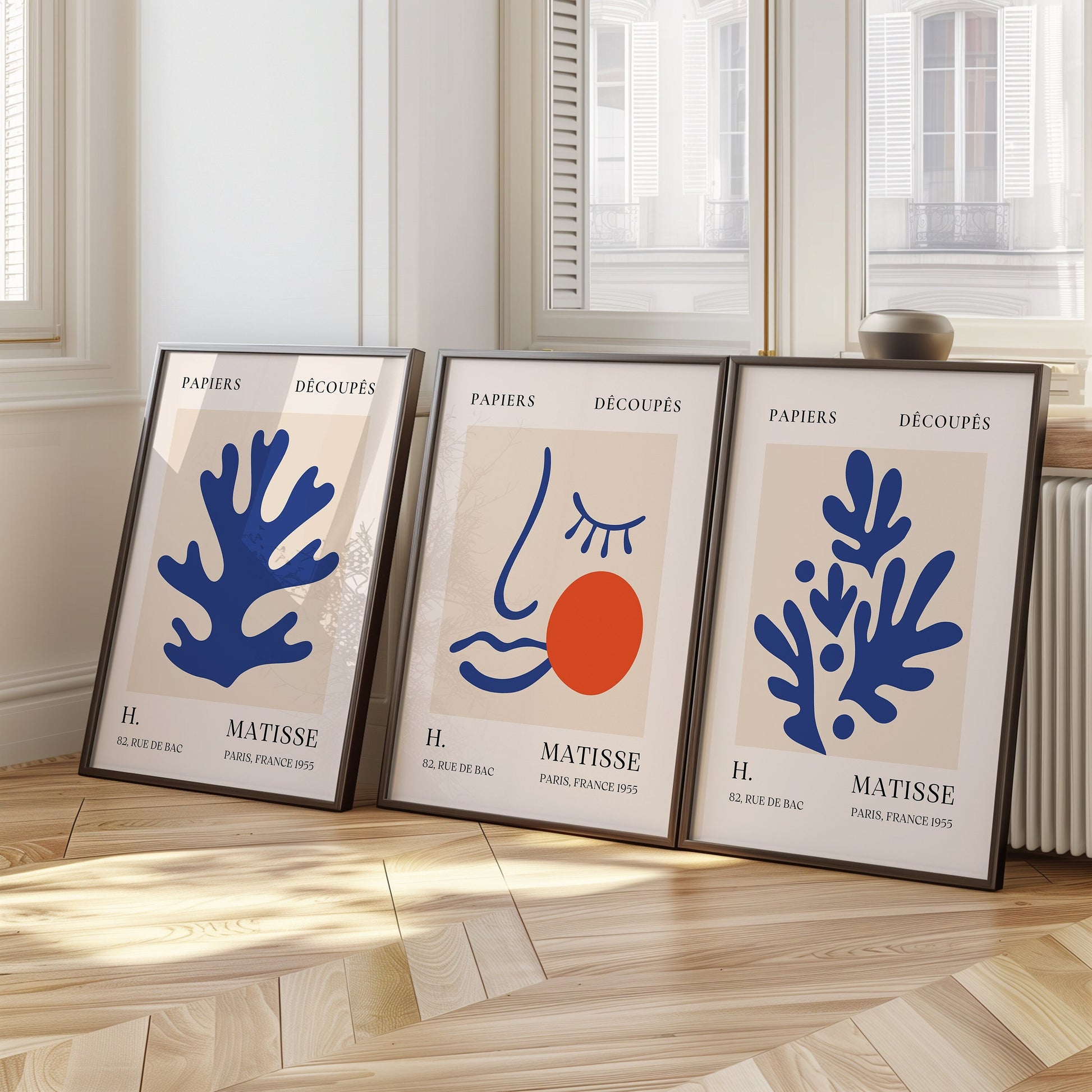 A trio of Henri Matisse posters featuring blue abstract cut-out designs and a minimalist face print, part of the Papiers Découpés collection, perfect for modern decor.