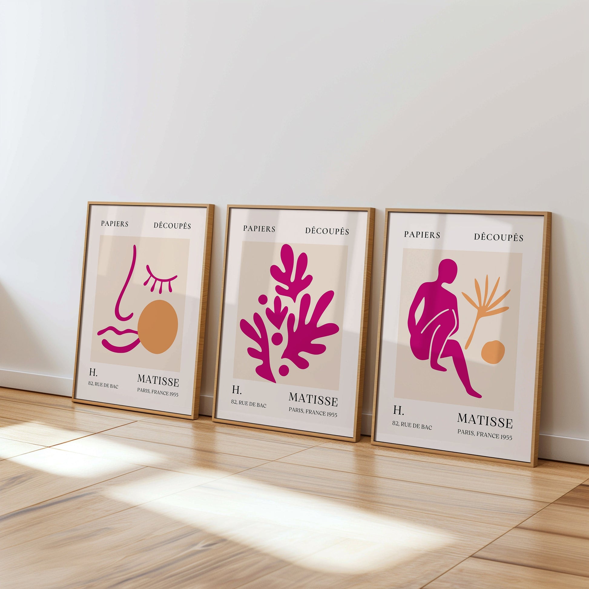 A trio of Henri Matisse posters featuring pink and orange abstract cut-out designs, including a face, from the Papiers Découpés collection, perfect for modern minimalist home decor.