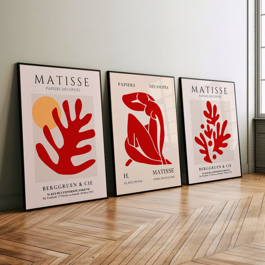 A set of three Henri Matisse posters featuring red abstract cut-out designs from the Papiers Découpés collection, perfect for modern and minimalist decor.