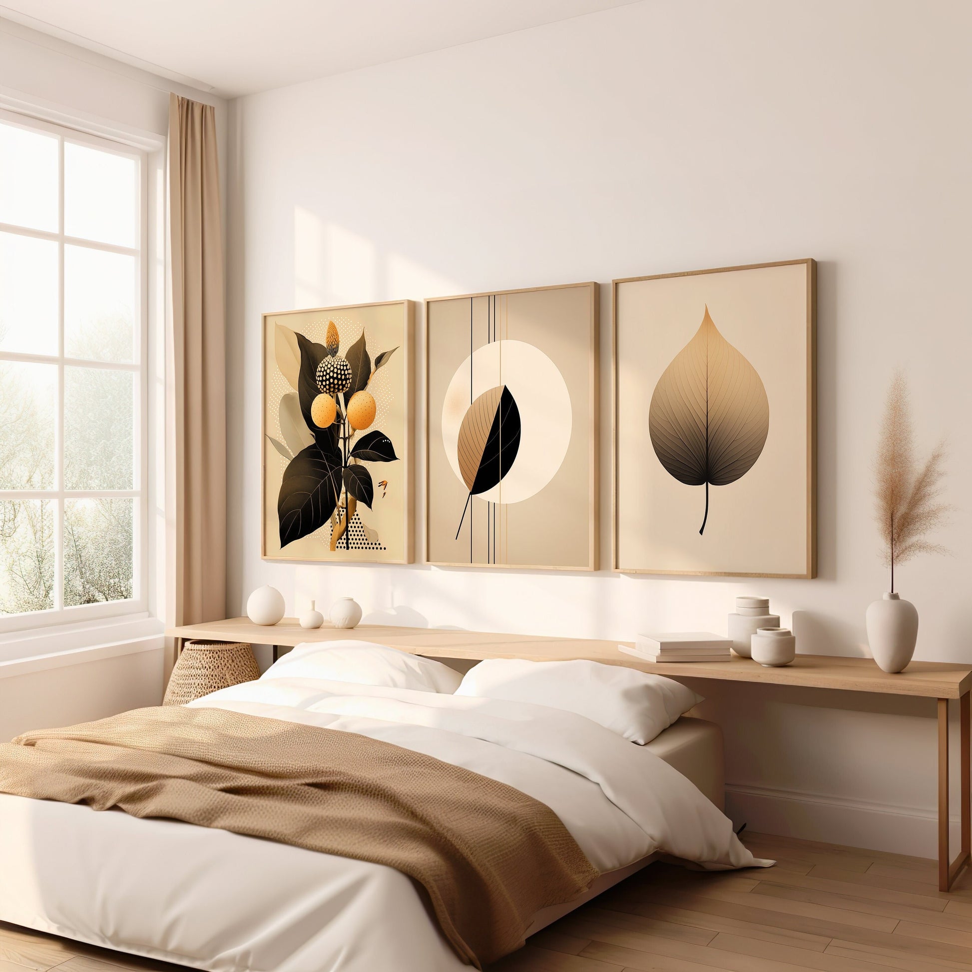 A set of three modern botanical prints featuring minimalist leaf designs in neutral tones, perfect for adding a sophisticated and calming touch to a bedroom.