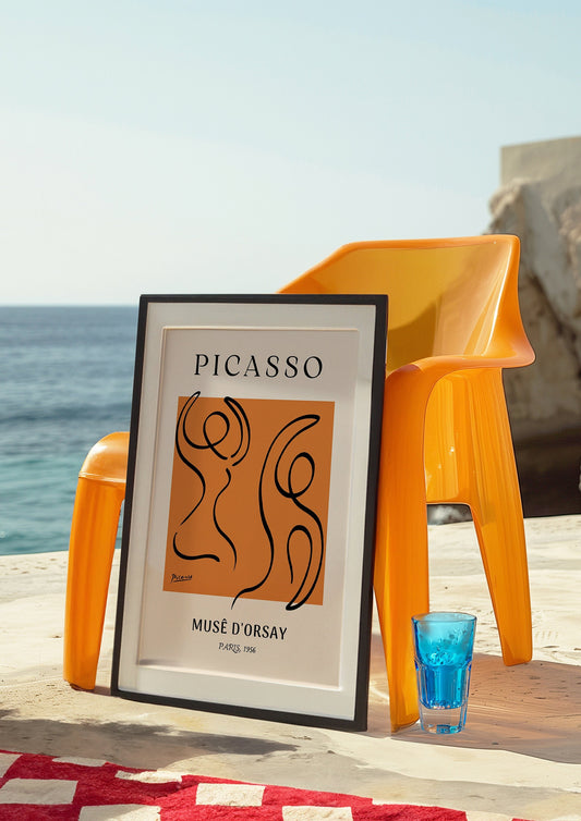 A minimalist Picasso poster featuring abstract black line drawings of figures on an orange background, with the words &quot;Musee D&#39;Orsay&quot; below, adding a modern artistic touch to any space.