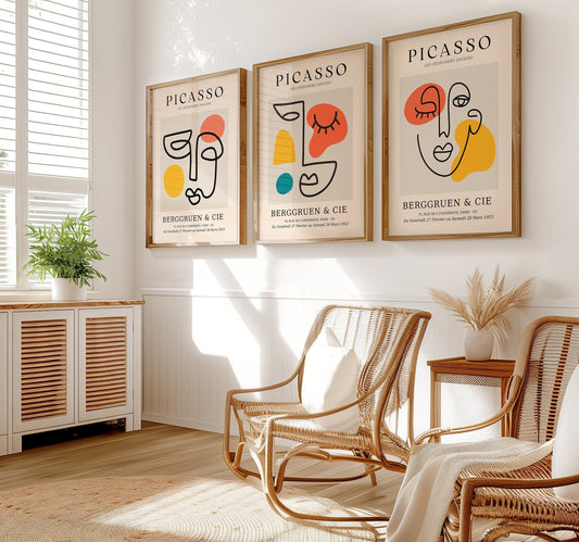 A set of three Picasso-inspired abstract line art posters, each featuring colorful geometric shapes and minimalist face illustrations in simple wooden frames.