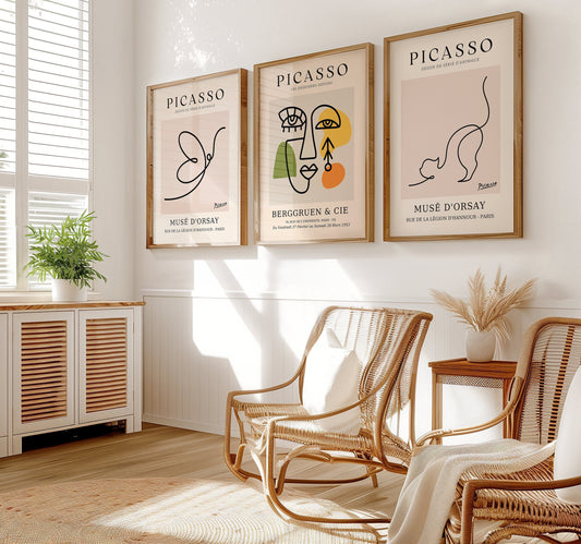 A set of three Picasso-inspired posters featuring abstract line art: a butterfly, a minimalist face, and a stretching cat, all in a modern, clean design.