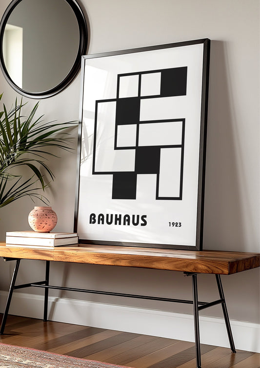 A black and white Bauhaus poster featuring a geometric abstract design of intersecting squares and rectangles, with the word &quot;Bauhaus&quot; and &quot;1923&quot; printed below.