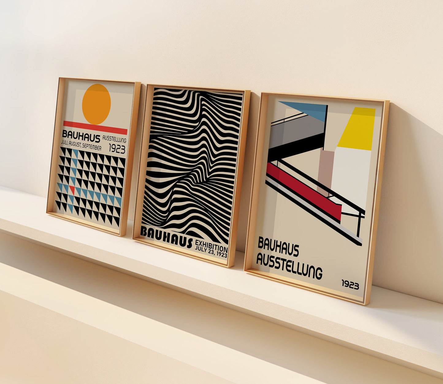 A set of three Bauhaus posters featuring designs inspired by Bauhaus exhibitions, with geometric patterns, wavy abstract lines, and architectural elements in warm tones, displayed in minimalist wooden frames.