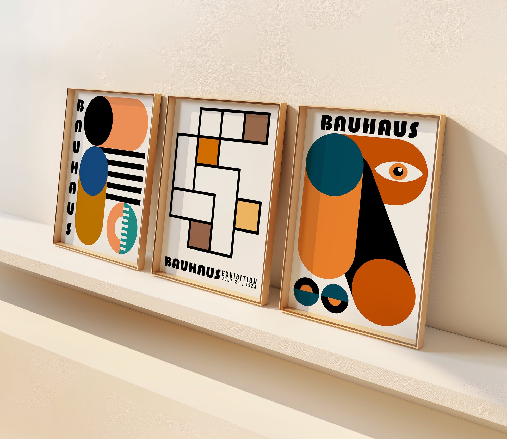 A set of three Bauhaus-inspired posters with geometric abstract designs in earthy tones, featuring bold shapes and patterns. The prints are framed and displayed on a light wooden floor, creating a modern and artistic atmosphere.