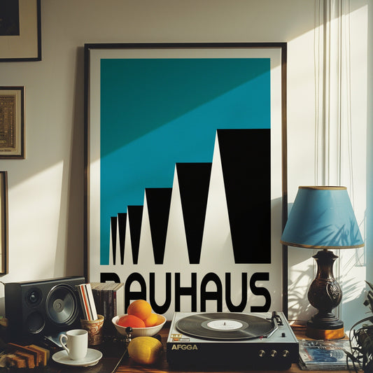 A Bauhaus-inspired modern art poster featuring bold black geometric shapes on a deep blue background, elegantly framed in gold, displayed in a stylish home office setting with ambient lighting.