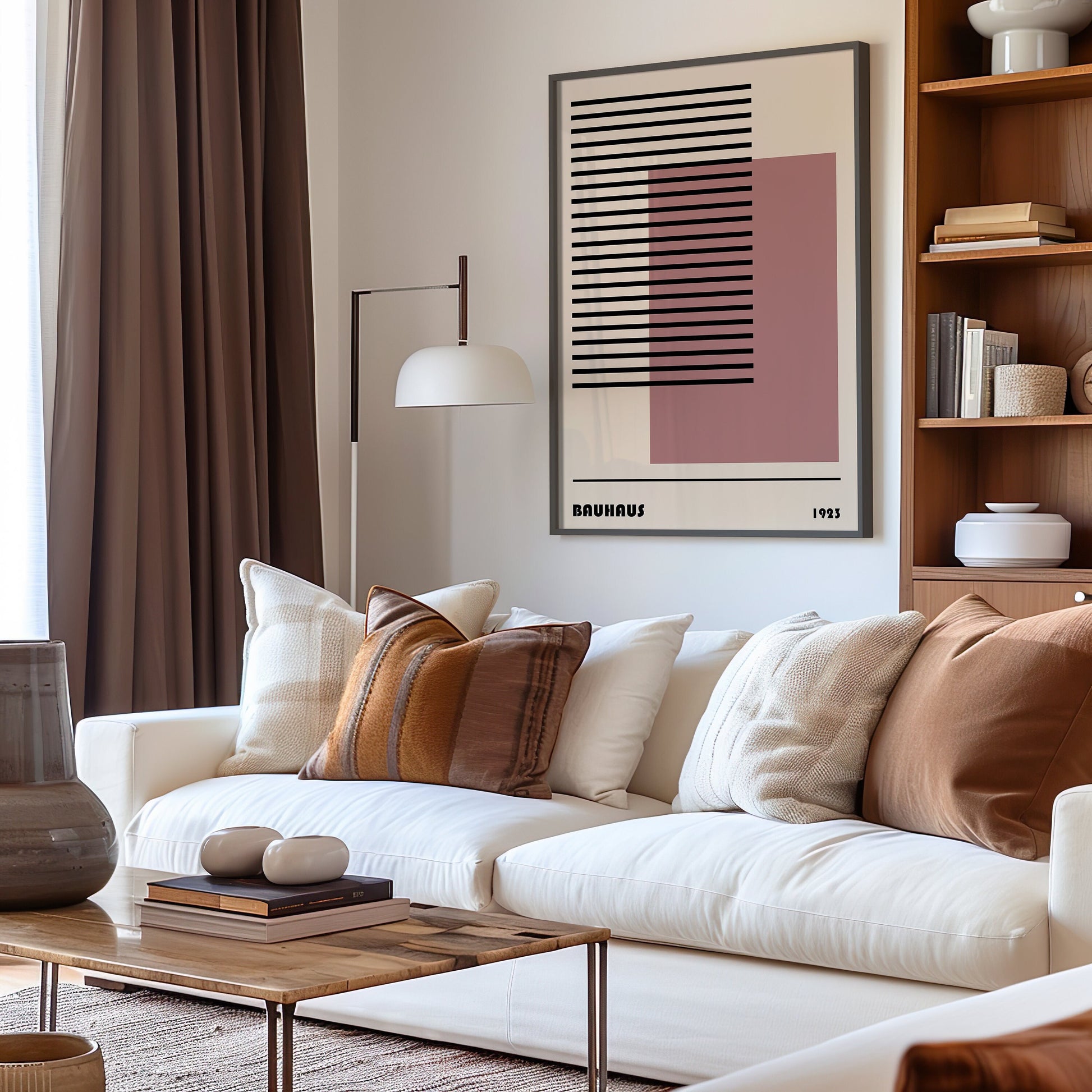 A minimalist Bauhaus art print featuring abstract geometric shapes with a focus on linear patterns and a soft pink block, displayed on a wooden bench with a small ceramic vase and books, reflecting mid-century modern style.