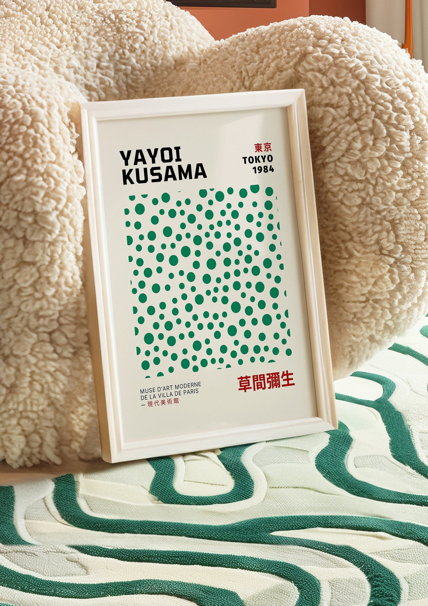 A minimalist Yayoi Kusama 1984 Tokyo poster showcasing green abstract dots against a white background, capturing the artist&#39;s signature polka dot style.