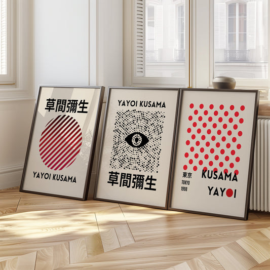 A modern set of three Yayoi Kusama posters showcasing a red and black striped circle, an eye design with dot details, and a classic red polka dot pattern from Kusama’s Tokyo 1998 collection.