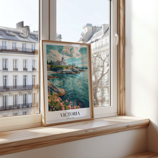 A beautiful poster of Victoria, Canada, featuring a scenic view of the coastline with a lighthouse and rocky shoreline, framed by blooming flowers and a calm ocean under a partly cloudy sky.