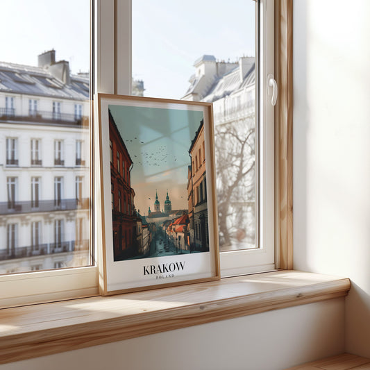 A beautiful poster of Krakow, Poland, featuring a view of the historic Old Town with St. Mary&#39;s Basilica in the distance, set against a warm, serene sky.