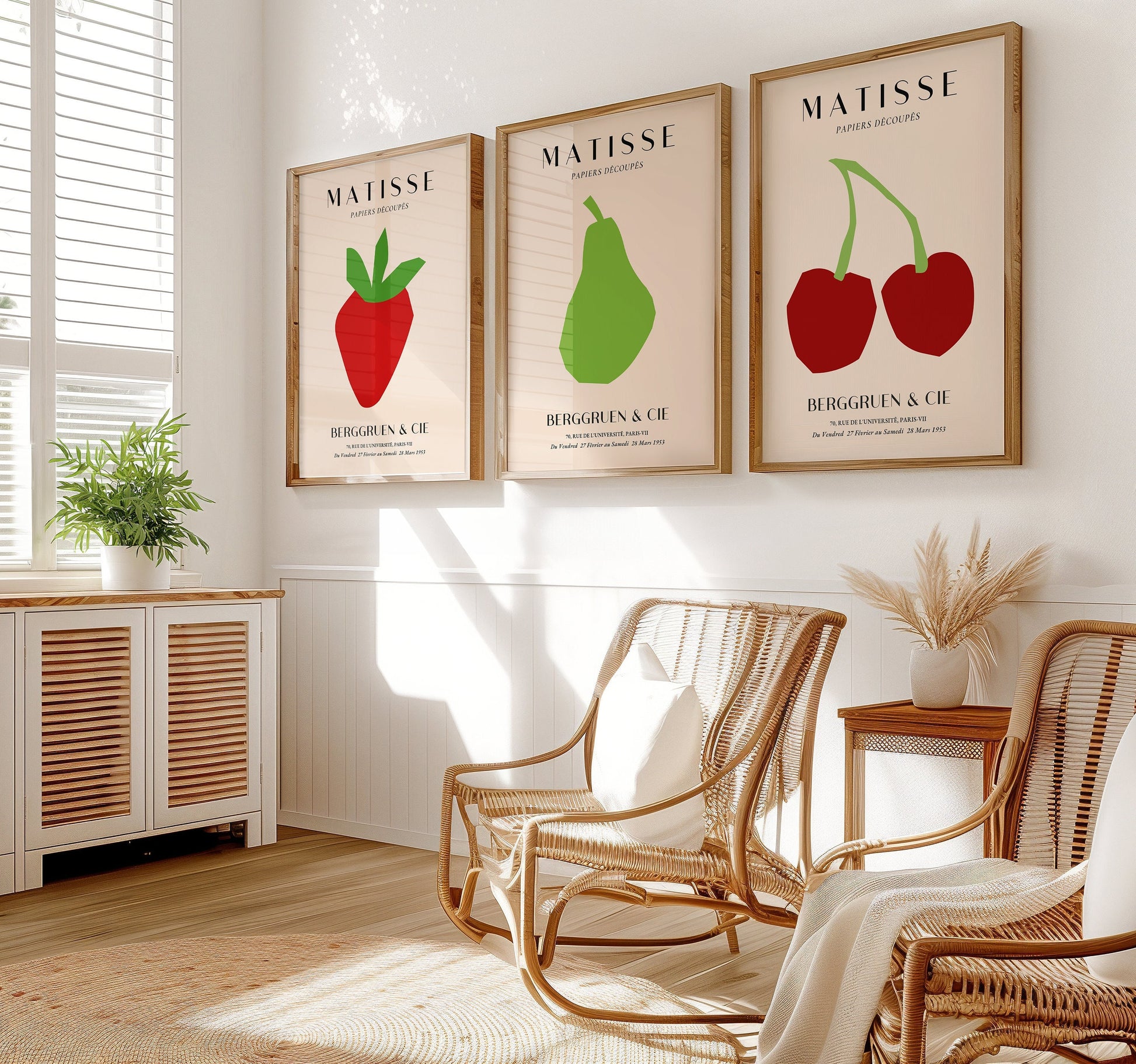 A minimalist set of Henri Matisse posters featuring cherries, a pear, and a strawberry in bold red and green cut-out designs from the Berggruen & Cie 1953 collection.