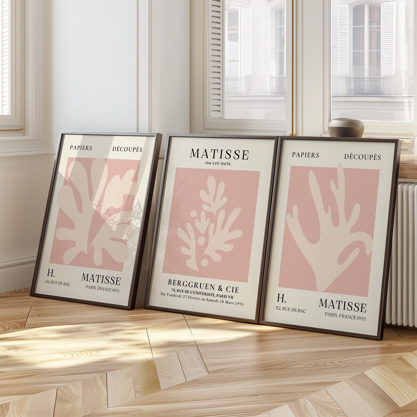 A set of three Henri Matisse posters in soft pink tones featuring minimalist cut-out designs from the Papiers Découpés collection, perfect for modern wall decor.