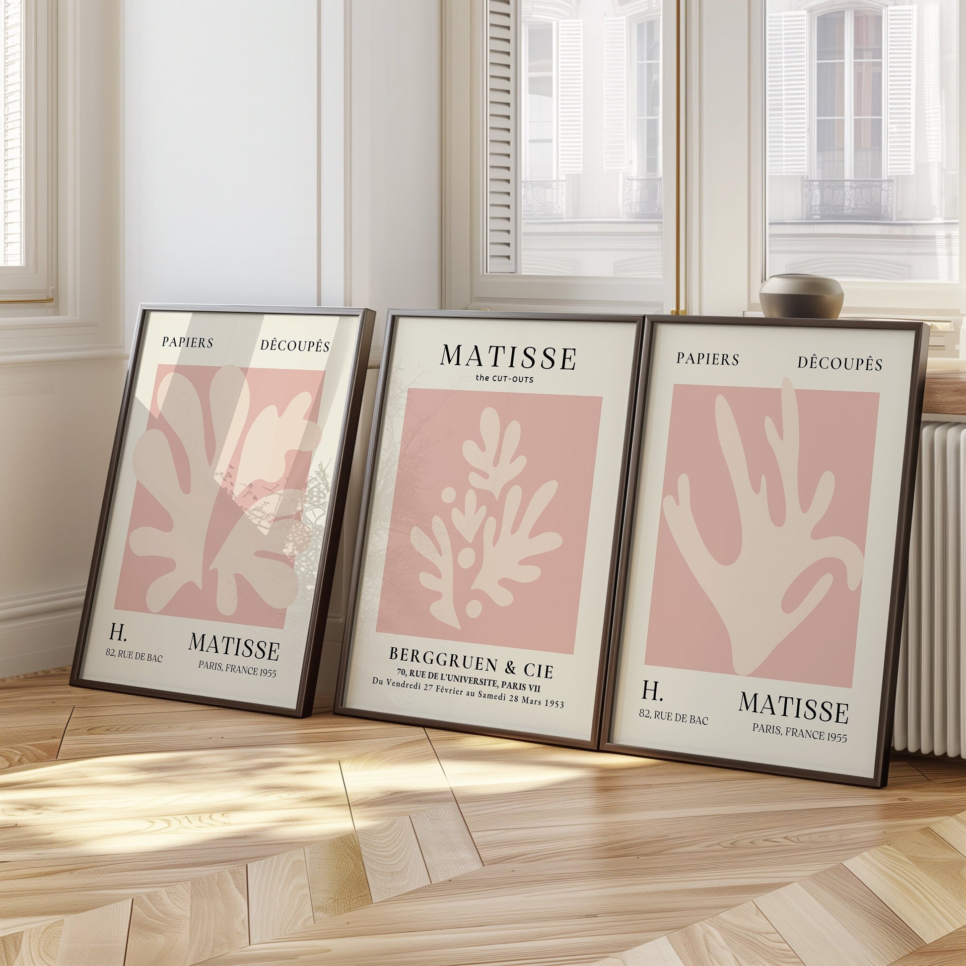 A set of three Henri Matisse posters in soft pink tones featuring minimalist cut-out designs from the Papiers Découpés collection, perfect for modern wall decor.