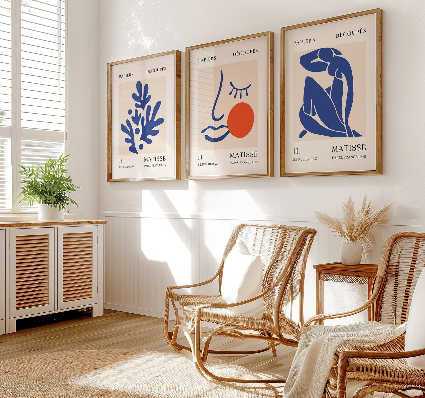 A set of three Henri Matisse posters featuring blue abstract cut-out designs and a minimalist face with an orange accent, part of the Papiers Découpés collection, perfect for modern home decor.